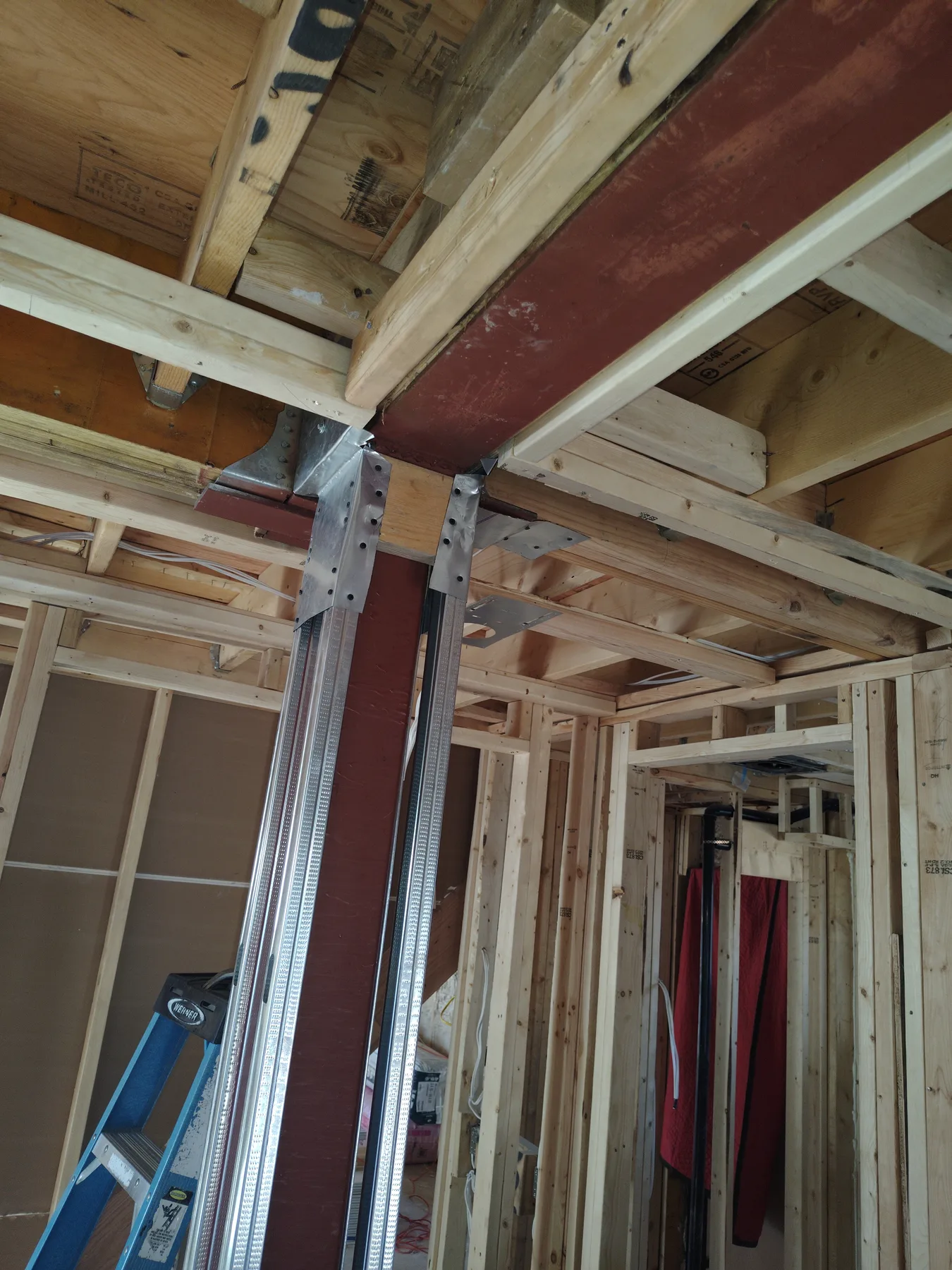 Steel beam transitioning into wood structure