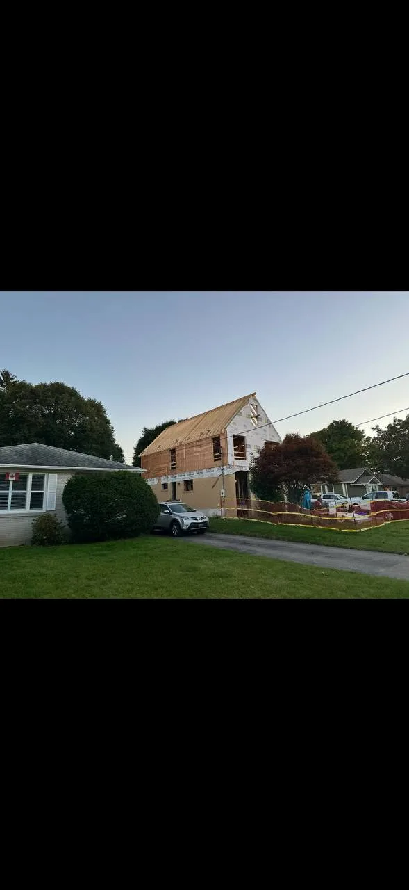Residential addition progressing through framing