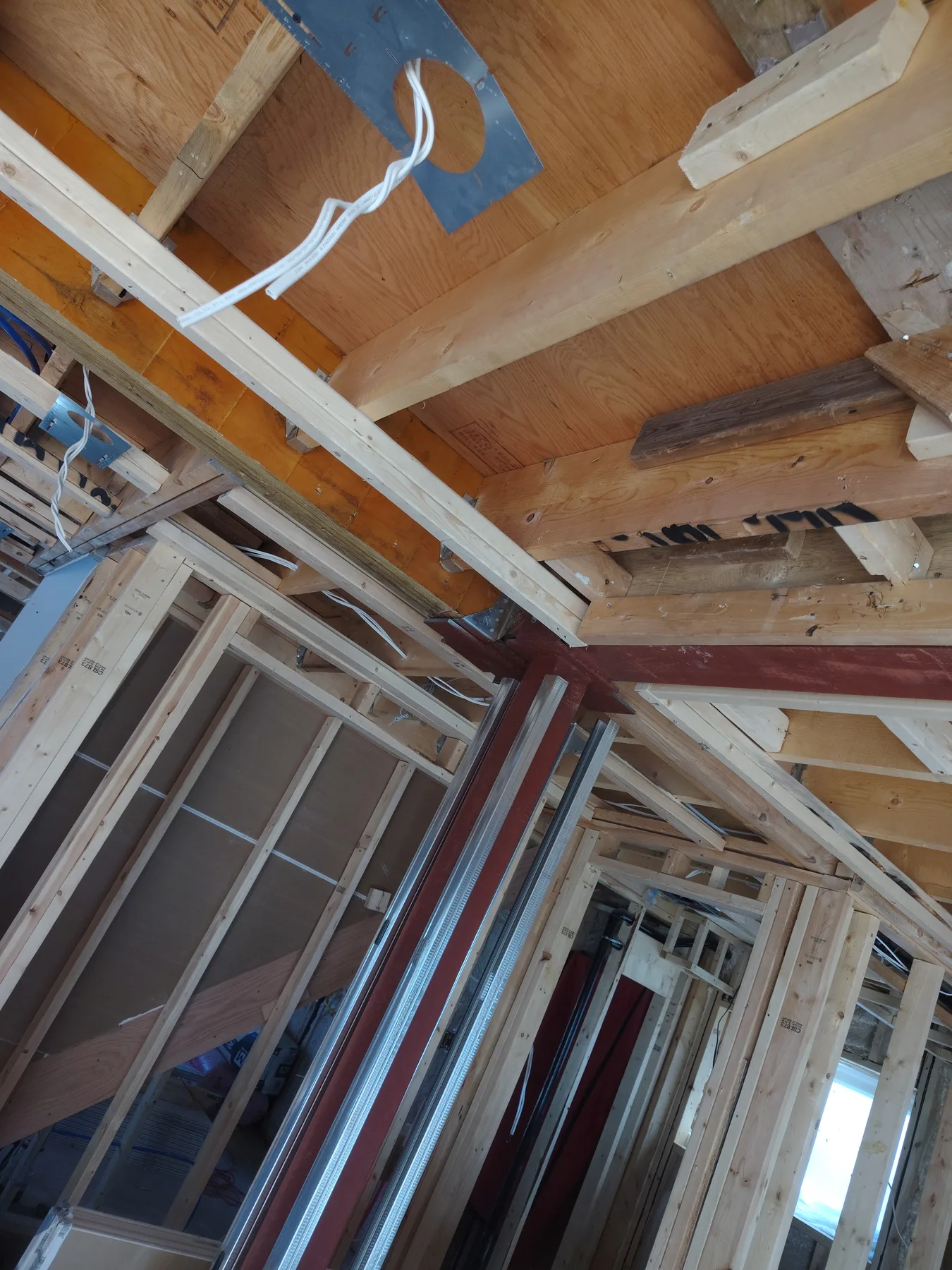 Structural beam coordinated with roof framing