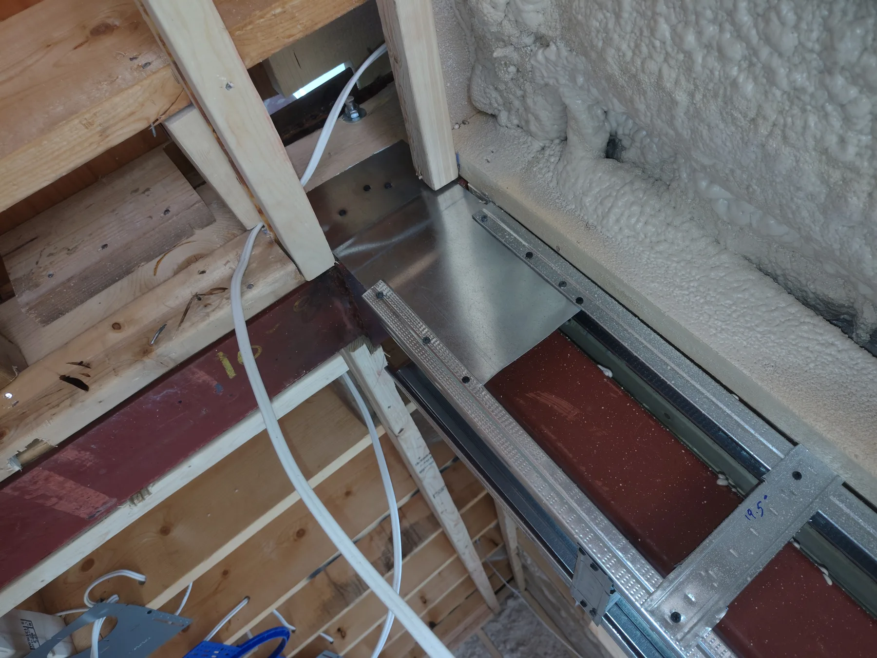 Steel beam integrated into existing wood framing